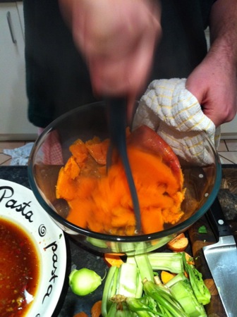 Mashing the sweet potatoes