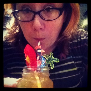 Dark & Stormy with paper straw, plastic palm tree, and a BIRD!