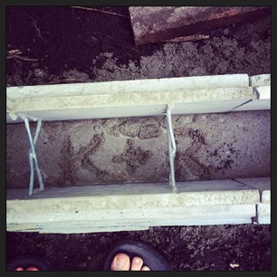 I asked the builders if I could put our initials in the wet concrete. They obliged.