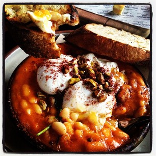 Turkish eggs with beans, yogurt, smoked paprika, pistachios, and toast. SO GOOD.
