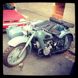 Someone in Chippo rides an army motorbike with a sidecar. Someone AWESOME.