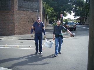 The men lug compost