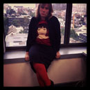 Black pencil skirt, Liza Minelli concert T-shirt, cardigan, orange tights