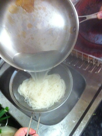 Draining the noodles