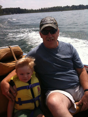 Dad and Isaiah on the boat