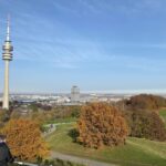 The Olympiaberg is the highest point in Munich Olympic Park, constructed from WW2 rubble. There was quite a crowd on the top, enjoying the spectacular views (so we wore our masks). We could just see the Alps! 🏔 @ Olympiapark München