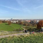 The Olympiaberg is the highest point in Munich Olympic Park, constructed from WW2 rubble. There was quite a crowd on the top, enjoying the spectacular views (so we wore our masks). We could just see the Alps! 🏔 @ Olympiapark München