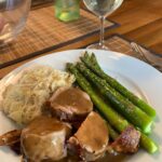 Bacon-wrapped pork loin, asparagus, and sauerkraut made by the Snook. 🥰 #spargelzeit