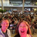Stage selfie with my cohost @rob_holub at #herhack 2021! Look at all these amazing hackers, raring to go! 👏👏👏