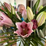 Mom sent me some lovely birthday flowers, but they do make it rather difficult to see my breakfast companion! 💐 (Thank you Susan Garberick!!)