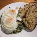 Garlicky white beans with spinach, poached eggs, and toast. #yummy 🍳