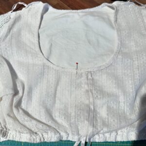 Very important and delicate mending complete! My lace dirndl blouse has a channel for a ribbon at the front so you can adjust the amount of décolletage you wish to display. However, mine was off-center and it always annoyed me. So today I *very carefully* unpicked the gauze, moved it, and reattached. It worked! #oktoberfestpreparation 🪡 🧵
