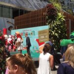 A dinosaur looks on while Santa kicks off the Christmas season in Brisbane. (Poor Santa must be sweating!) ☀️🎅😰