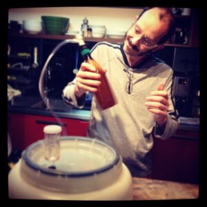 He's wearing safety goggles because he's "doing science." BEER SCIENCE!