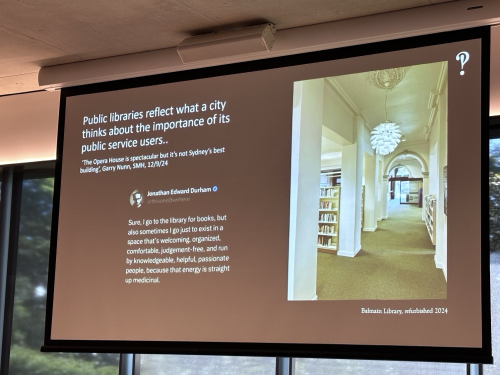 A slide with a photograph of a library on it, and text that says "Public libraries reflect what a city thinks about the importance of its public service users."