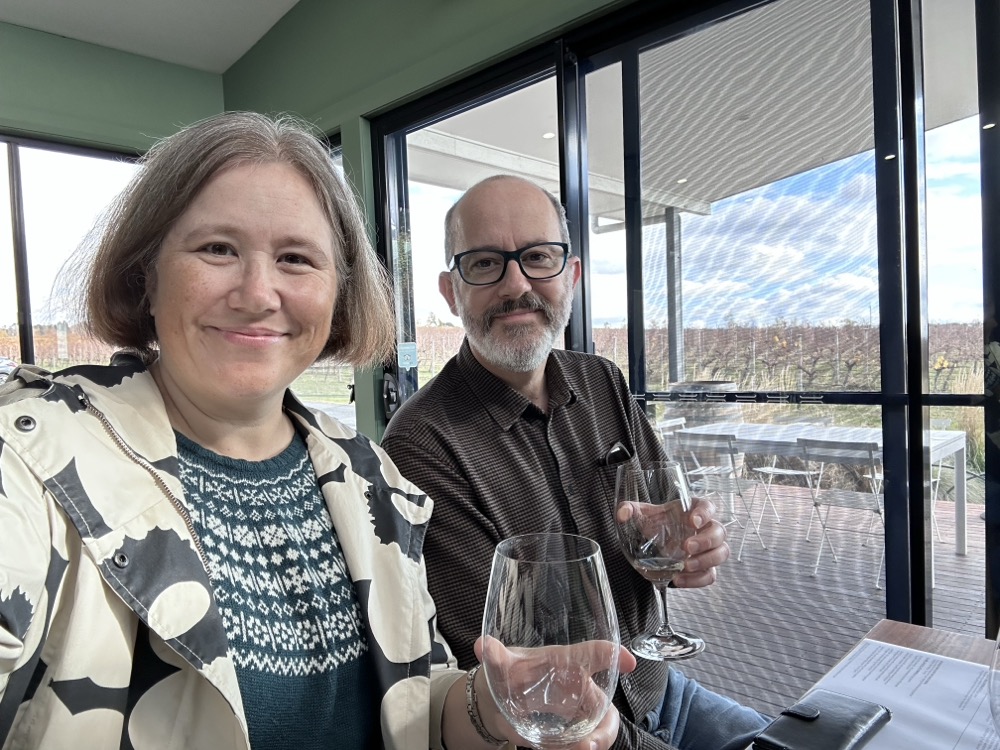 Two people holding wine glasses