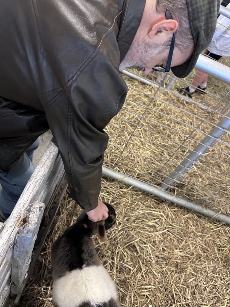 Rodd petting a goat